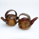 Tea pot with copper handle